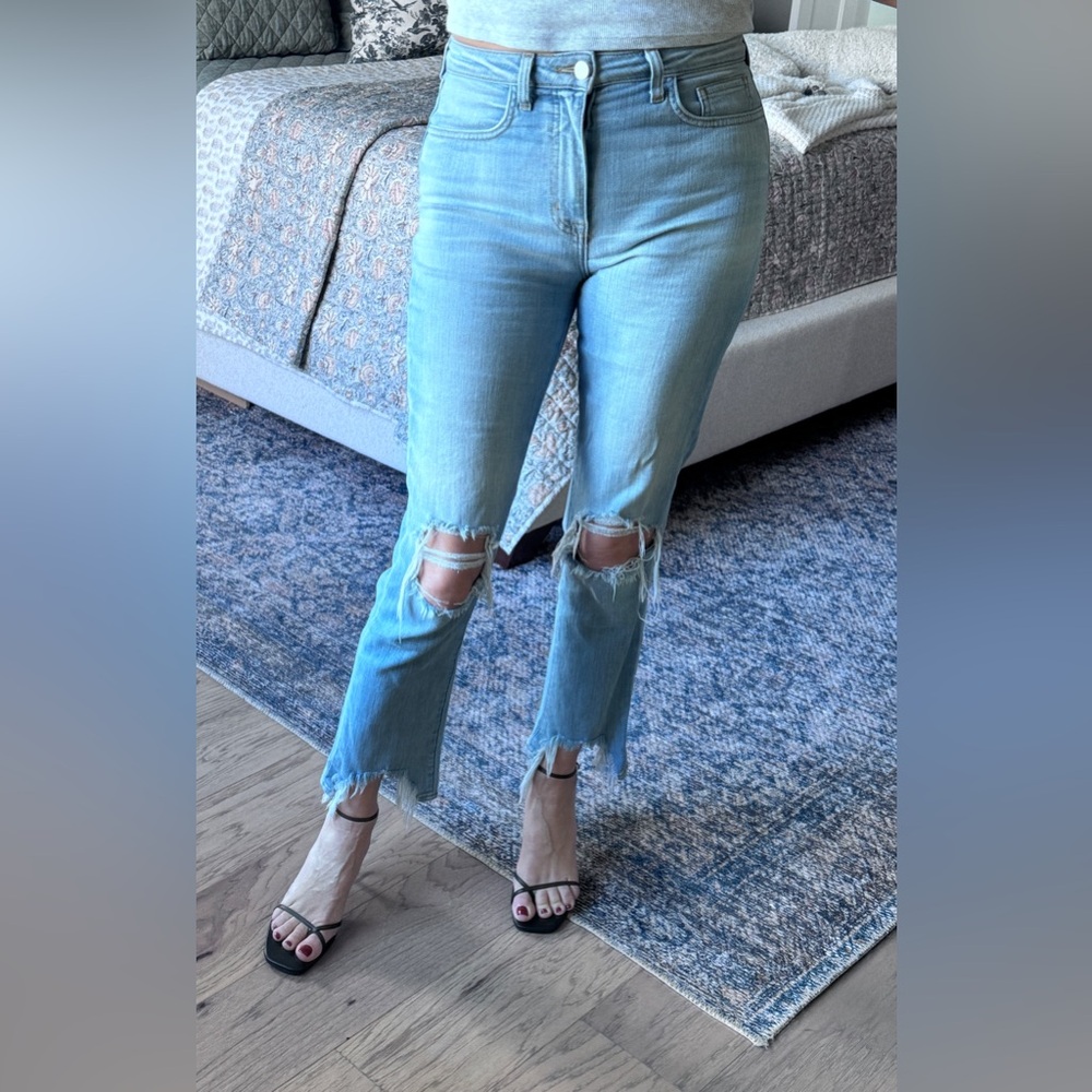 L’AGENCE distressed, light wash stretch denim jeans